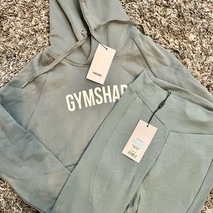 Brand new with tags on. Gymshark crop sweatshirt and high waisted leggings.